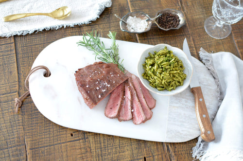 Alberta raised flank steak beef, peppercorn & herb marinade, green pesto orzo.